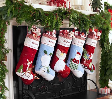 <p>This sweet dog has donned a reindeer disguise and wont bark when Santa comes down the chimney. . Pottery barn christmas stockings
